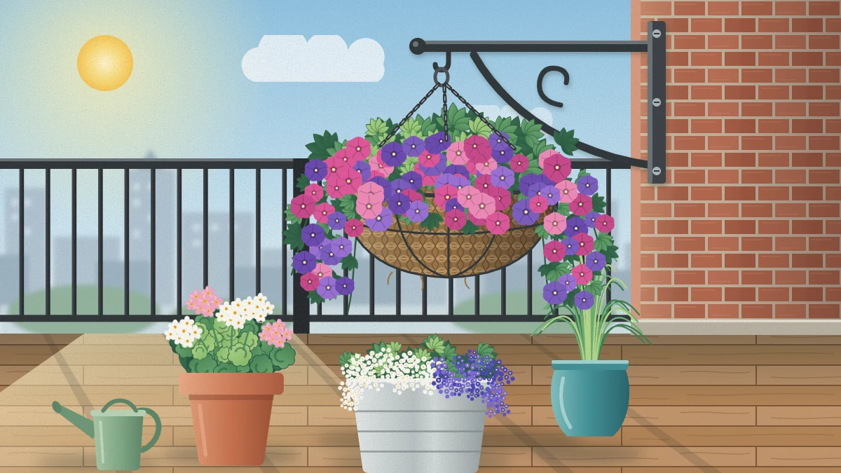 A coir-lined hanging basket full of pink and purple trailing petunias hanging by chains over a balcony floor, well inside the railing.